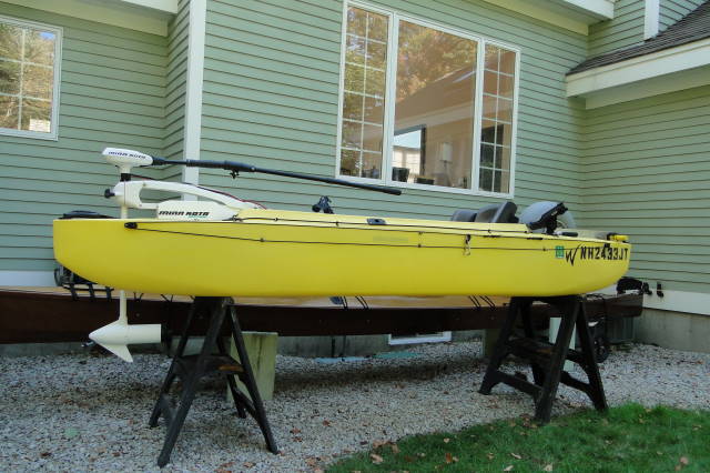 Offshore fishing kayak rigged with trolling motor, and wheel for transportation