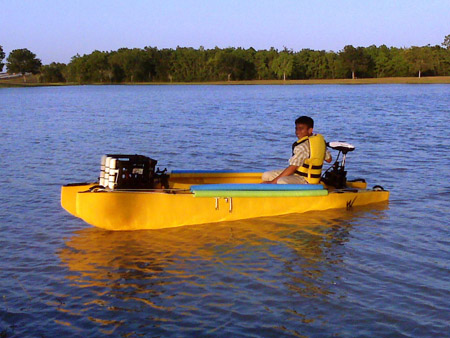 Rainier driving Noel's motorized fishing kayak