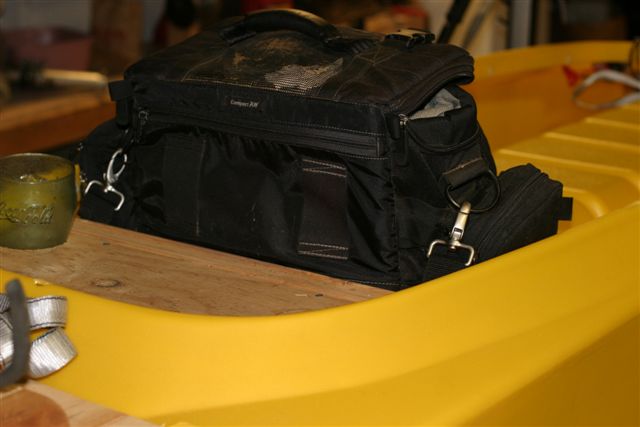 Camera case in fishing kayak rigged for photography