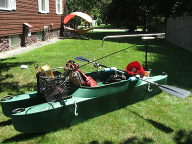 Fully rigged fishing kayak with electric trolling motor