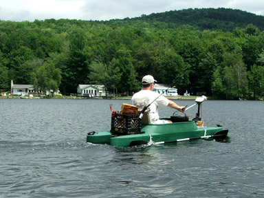 Fishing kayak rigged with electric motor trolling lake Champlain, Vermont