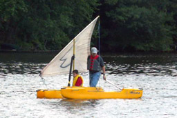 Sailing a kayak with an outrigger